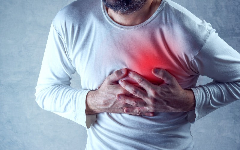 severe heartache man suffering from chest pain having painful