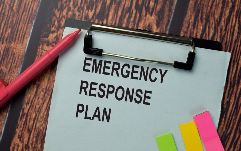 emergency response plan write paperwork isolated office desk